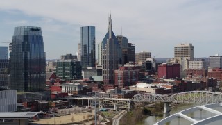 DX0002_116_035 - 5.7K aerial stock footage of a view the AT&T Building seen from the river in Downtown Nashville, Tennessee