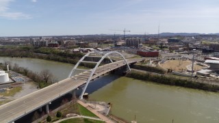 5.7K aerial stock footage descending near the Korean War Veterans Memorial Bridge as cars cross in Nashville, Tennessee Aerial Stock Footage | DX0002_117_018