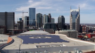 5.7K aerial stock footage of flying over the convention center to approach skyline of Downtown Nashville, Tennessee Aerial Stock Footage | DX0002_117_047