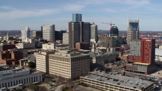 5.7K aerial stock footage flyby of Renaissance Nashville Hotel near skyscrapers during descent in Downtown Nashville, Tennessee Aerial Stock Footage | DX0002_118_011