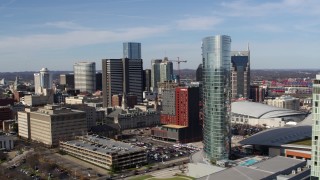 DX0002_118_012 - 5.7K aerial stock footage orbit the JW Marriott hotel near skyscrapers in Downtown Nashville, Tennessee