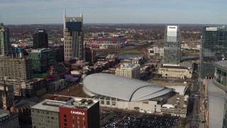 DX0002_119_015 - 5.7K aerial stock footage approach Bridgestone Arena between AT&T Building, Pinnacle skyscraper, Downtown Nashville, Tennessee