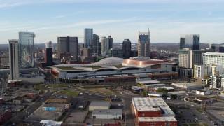 5.7K aerial stock footage ascend and flyby Nashville Music City Center and city's skyline, Downtown Nashville, Tennessee Aerial Stock Footage | DX0002_119_021