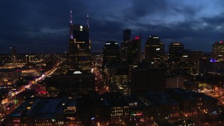 5.7K aerial stock footage reverse view of AT&T Building and skyline at twilight, Downtown Nashville, Tennessee Aerial Stock Footage | DX0002_121_012