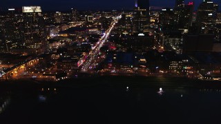 5.7K aerial stock footage fly away from Broadway and traffic at twilight, reveal skyscrapers, Downtown Nashville, Tennessee Aerial Stock Footage | DX0002_121_018