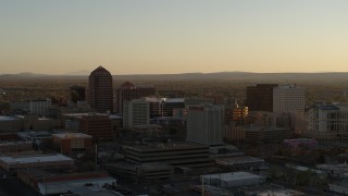 5.7K aerial stock footage of high-rise office buildings at sunset during ascent in Downtown Albuquerque, New Mexico Aerial Stock Footage | DX0002_122_031