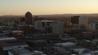 5.7K aerial stock footage approach and then flyby office high-rises at sunset, Downtown Albuquerque, New Mexico Aerial Stock Footage | DX0002_122_045