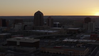 5.7K aerial stock footage of an office tower and shorter hotel tower at sunset, Downtown Albuquerque, New Mexico Aerial Stock Footage | DX0002_122_047