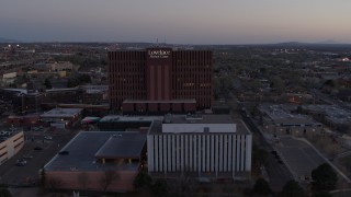 5.7K aerial stock footage of orbiting a hospital at sunset in Albuquerque, New Mexico Aerial Stock Footage | DX0002_123_003