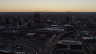 5.7K aerial stock footage approach and pass Albuquerque Plaza and Hyatt Regency at sunset near office high-rises, Downtown Albuquerque, New Mexico Aerial Stock Footage | DX0002_123_007