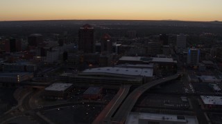 5.7K aerial stock footage flyby and way from Albuquerque Plaza and Hyatt Regency at sunset, Downtown Albuquerque, New Mexico Aerial Stock Footage | DX0002_123_012