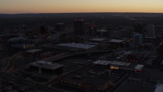 5.7K aerial stock footage orbit Albuquerque Plaza and Hyatt Regency at sunset, Downtown Albuquerque, New Mexico Aerial Stock Footage | DX0002_123_014