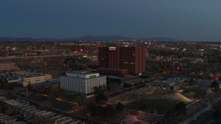 5.7K aerial stock footage of a reverse view of a hospital complex at twilight in Albuquerque, New Mexico Aerial Stock Footage | DX0002_123_021