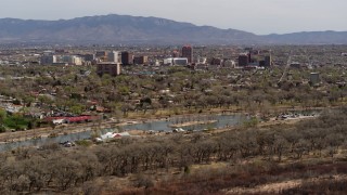 5.7K aerial stock footage of high-rise office buildings seen from Tingley Beach, Downtown Albuquerque, New Mexico Aerial Stock Footage | DX0002_124_010