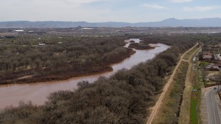 DX0002_124_015 - 5.7K aerial stock footage of flying by the Rio Grande river in Albuquerque, New Mexico