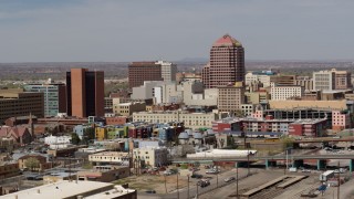 5.7K aerial stock footage of an office high-rise towering over city buildings, Downtown Albuquerque, New Mexico Aerial Stock Footage | DX0002_124_022