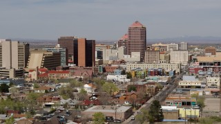 5.7K aerial stock footage fly away from and by Albuquerque Plaza office high-rise and surrounding buildings, Downtown Albuquerque, New Mexico Aerial Stock Footage | DX0002_124_027