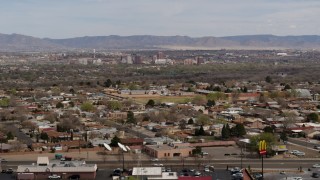 5.7K aerial stock footage of Downtown Albuquerque, seen from suburban homes, New Mexico Aerial Stock Footage | DX0002_126_011