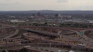 5.7K aerial stock footage of Downtown Albuquerque buildings seen while flying by freeway interchange traffic, New Mexico Aerial Stock Footage | DX0002_126_029