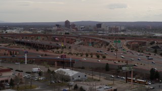 5.7K aerial stock footage of Downtown Albuquerque buildings seen from a freeway interchange, New Mexico Aerial Stock Footage | DX0002_126_032