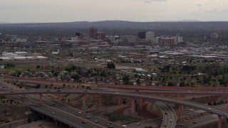 5.7K aerial stock footage of Downtown Albuquerque high-rises seen from freeway interchange, New Mexico Aerial Stock Footage | DX0002_126_034