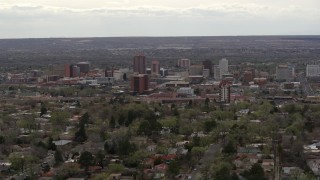 5.7K aerial stock footage of the city's high-rise buildings seen while passing by neighborhood, Downtown Albuquerque, New Mexico Aerial Stock Footage | DX0002_126_039