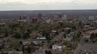 5.7K aerial stock footage wide view of city's high-rises seen while flying by homes, Downtown Albuquerque, New Mexico Aerial Stock Footage | DX0002_126_043