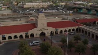 DX0002_127_019 - 5.7K aerial stock footage of an orbit of the Albuquerque train station, Downtown Albuquerque, New Mexico