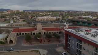 5.7K aerial stock footage reverse view of the entrance of the Albuquerque train station, Downtown Albuquerque, New Mexico Aerial Stock Footage | DX0002_127_022