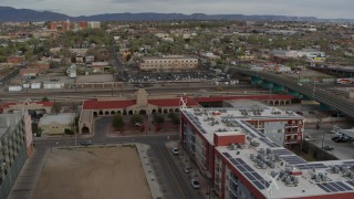 5.7K aerial stock footage orbit and stationary view of the entrance of the Albuquerque train station, Downtown Albuquerque, New Mexico Aerial Stock Footage | DX0002_127_023