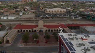 DX0002_127_024 - 5.7K aerial stock footage approach the entrance of the Albuquerque train station, Downtown Albuquerque, New Mexico