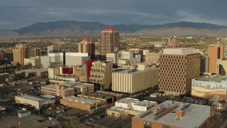 5.7K aerial stock footage approach and flyby Albuquerque Plaza towering over city buildings, Downtown Albuquerque, New Mexico Aerial Stock Footage | DX0002_127_029