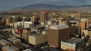 5.7K aerial stock footage flyby federal building, focus on Albuquerque Plaza high-rise, Downtown Albuquerque, New Mexico Aerial Stock Footage | DX0002_127_033