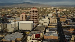 DX0002_127_034 - 5.7K aerial stock footage circling around Albuquerque Plaza high-rise and city buildings, Downtown Albuquerque, New Mexico