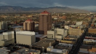 5.7K aerial stock footage ascend and fly away from office high-rise building, Downtown Albuquerque, New Mexico Aerial Stock Footage | DX0002_127_039