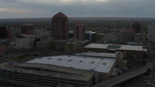 5.7K aerial stock footage orbit office high-rise and hotel by convention center at sunset, Downtown Albuquerque, New Mexico Aerial Stock Footage | DX0002_128_004