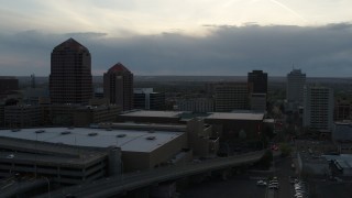 5.7K aerial stock footage flyby office tower, hotel, Kiva Auditorium, convention center at sunset, Downtown Albuquerque, New Mexico Aerial Stock Footage | DX0002_128_011