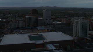 5.7K aerial stock footage flyby hotel, office buildings, Kiva Auditorium at sunset, Downtown Albuquerque, New Mexico Aerial Stock Footage | DX0002_128_013