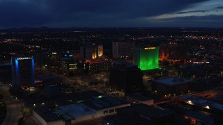 DX0002_128_037 - 5.7K aerial stock footage flyby hotel and office buildings, approach Wells Fargo Building at twilight, Downtown Albuquerque, New Mexico