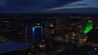 5.7K aerial stock footage fly away from office buildings, reveal hotel at twilight, Downtown Albuquerque, New Mexico Aerial Stock Footage | DX0002_128_039