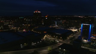 5.7K aerial stock footage wide orbit of office high-rise, hotel and auditorium at twilight, Downtown Albuquerque, New Mexico Aerial Stock Footage | DX0002_128_045