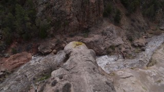 5.7K aerial stock footage circling above river rapids flowing through a rock formation in the mountains in New Mexico Aerial Stock Footage | DX0002_129_004