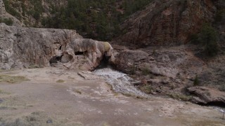 5.7K aerial stock footage descend for low view of river rapids flowing through a rock formation in the mountains in New Mexico Aerial Stock Footage | DX0002_129_008