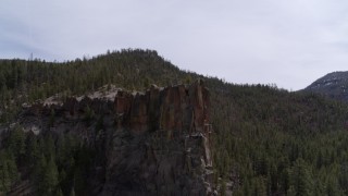 5.7K aerial stock footage of approaching a rock formation in the mountains in New Mexico Aerial Stock Footage | DX0002_129_009