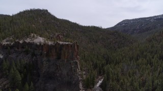 5.7K aerial stock footage of circling a rock formation in the mountains in New Mexico Aerial Stock Footage | DX0002_129_011