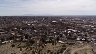 5.7K aerial stock footage wide view of the downtown area, surrounding city of Santa Fe, New Mexico during descent Aerial Stock Footage | DX0002_129_026