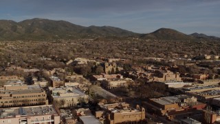 5.7K aerial stock footage of the cathedral seen while passing Santa Fe Plaza, Santa Fe, New Mexico Aerial Stock Footage | DX0002_132_012