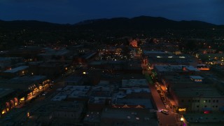 5.7K aerial stock footage of the cathedral lit up at night at the end of San Francisco Street, Santa Fe, New Mexico Aerial Stock Footage | DX0002_132_014