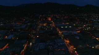 5.7K aerial stock footage ascend by downtown, reveal San Francisco Street leading to cathedral at night, Santa Fe, New Mexico Aerial Stock Footage | DX0002_132_018