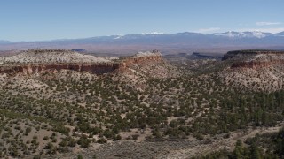 5.7K aerial stock footage of a reverse view of desert mesas in New Mexico Aerial Stock Footage | DX0002_133_006